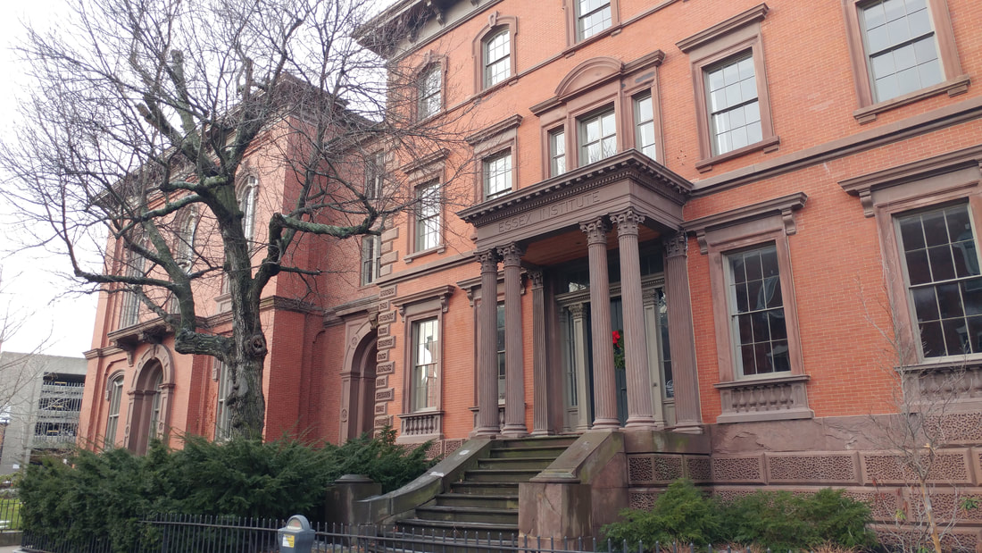 Photo of original Phillips Library, a large brick mansion, of the Peabody Essex Museum