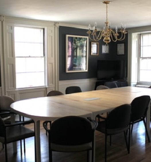 The conference room with an empty conference table in the Historic Salem, Inc. Headquarters.