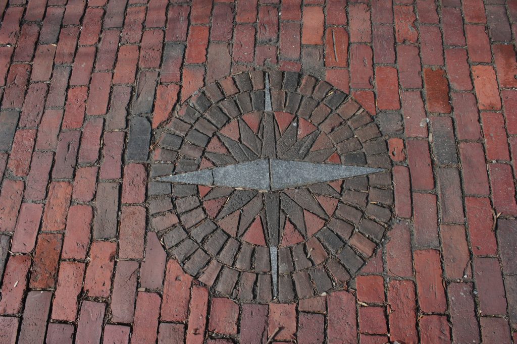 Brick sidewalk with inlaid compass rose