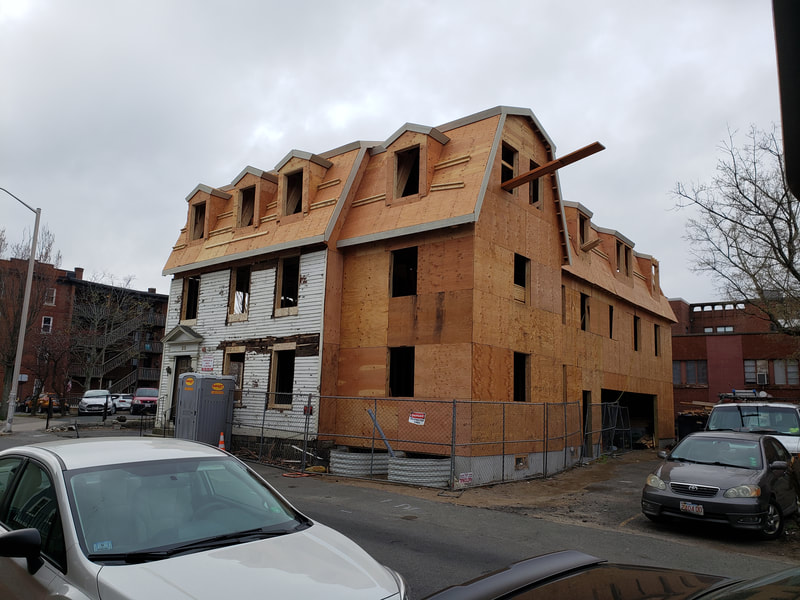 25 Lynde St. reconstruction with only original façade remaining.